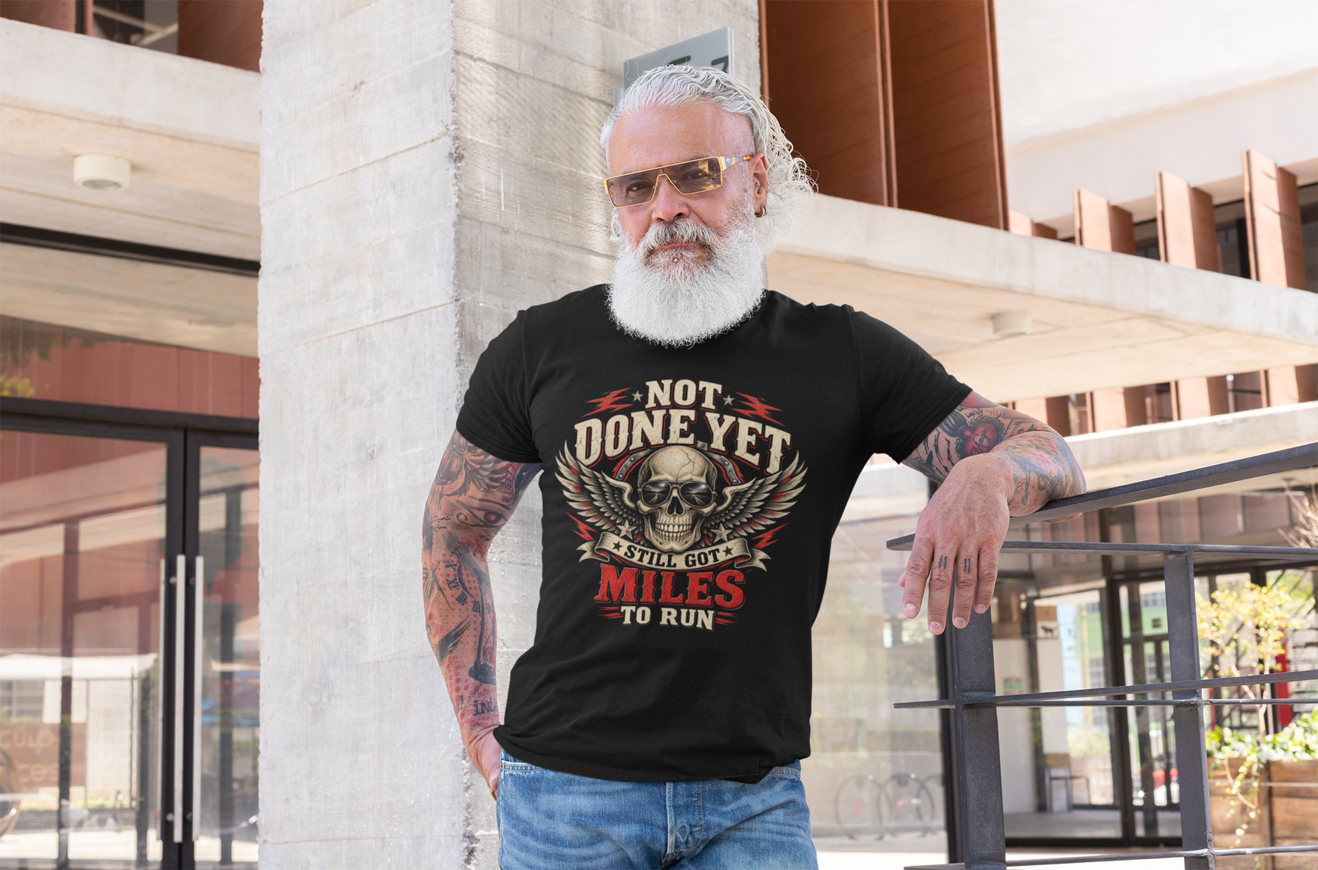 Man wearing I Drag Houses black T-shirt outdoors.