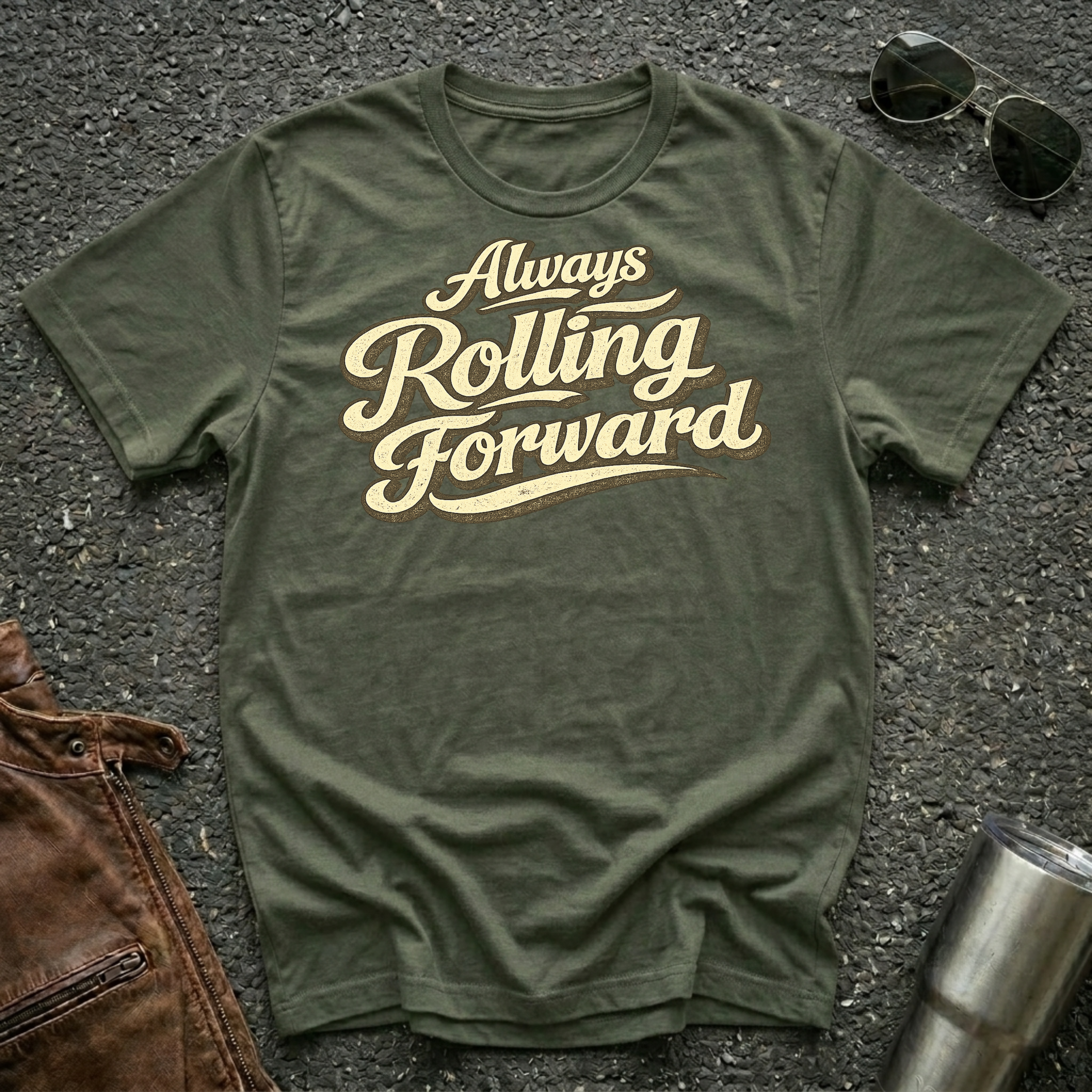 Military green 'Always Rolling Forward' road life T-shirt featuring vintage cream typography on a soft unisex tee.