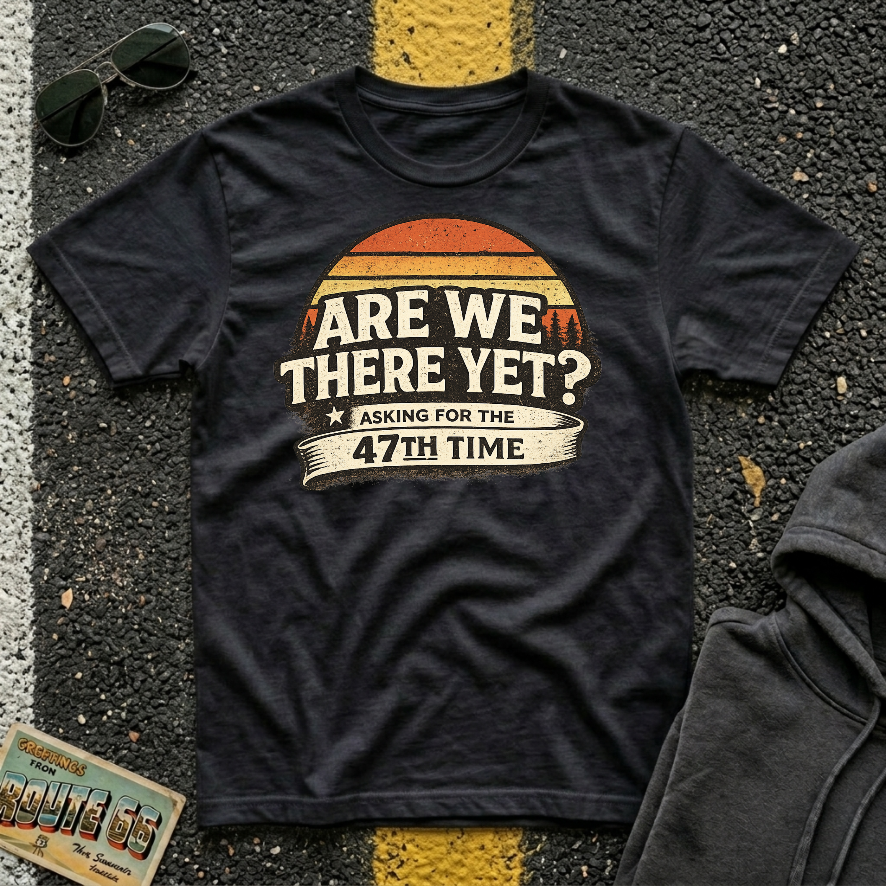 Are We There Yet? Asking for the 47th Time T-shirt by The Riverstone Life on a black Gildan Softstyle 64000 featuring a humorous road trip design.