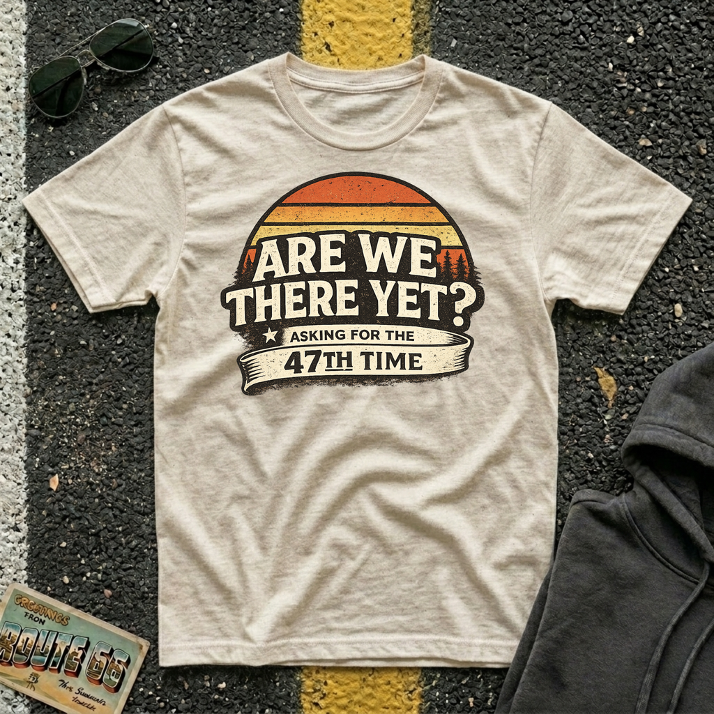 Are We There Yet? Asking for the 47th Time T-shirt by The Riverstone Life on a natural Gildan Softstyle 64000 featuring a humorous road trip design.
