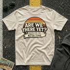 Are We There Yet? Asking for the 47th Time T-shirt by The Riverstone Life on a natural Gildan Softstyle 64000 featuring a humorous road trip design.
