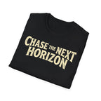 A folded black t-shirt with the phrase 'CHASE THE NEXT HORIZON' printed across the chest in a distressed cream-colored font, shown on a plain white background.