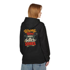 A woman shown from the back wearing a black hoodie with a colorful graphic 'WRONG TURNS MAKE BETTER STORIES text print on the back, paired with light blue jeans, against a plain white background.