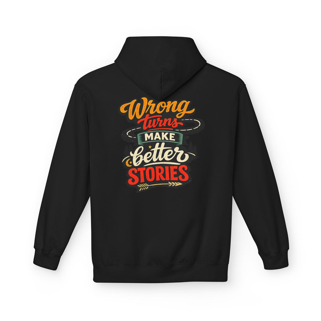 A black pullover hoodie shown from the back, featuring a colorful graphic text print that reads 'Wrong turns make better stories' in orange, red, white, and green lettering.