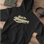 A black hoodie on a flat lay 'Built For Transport' 