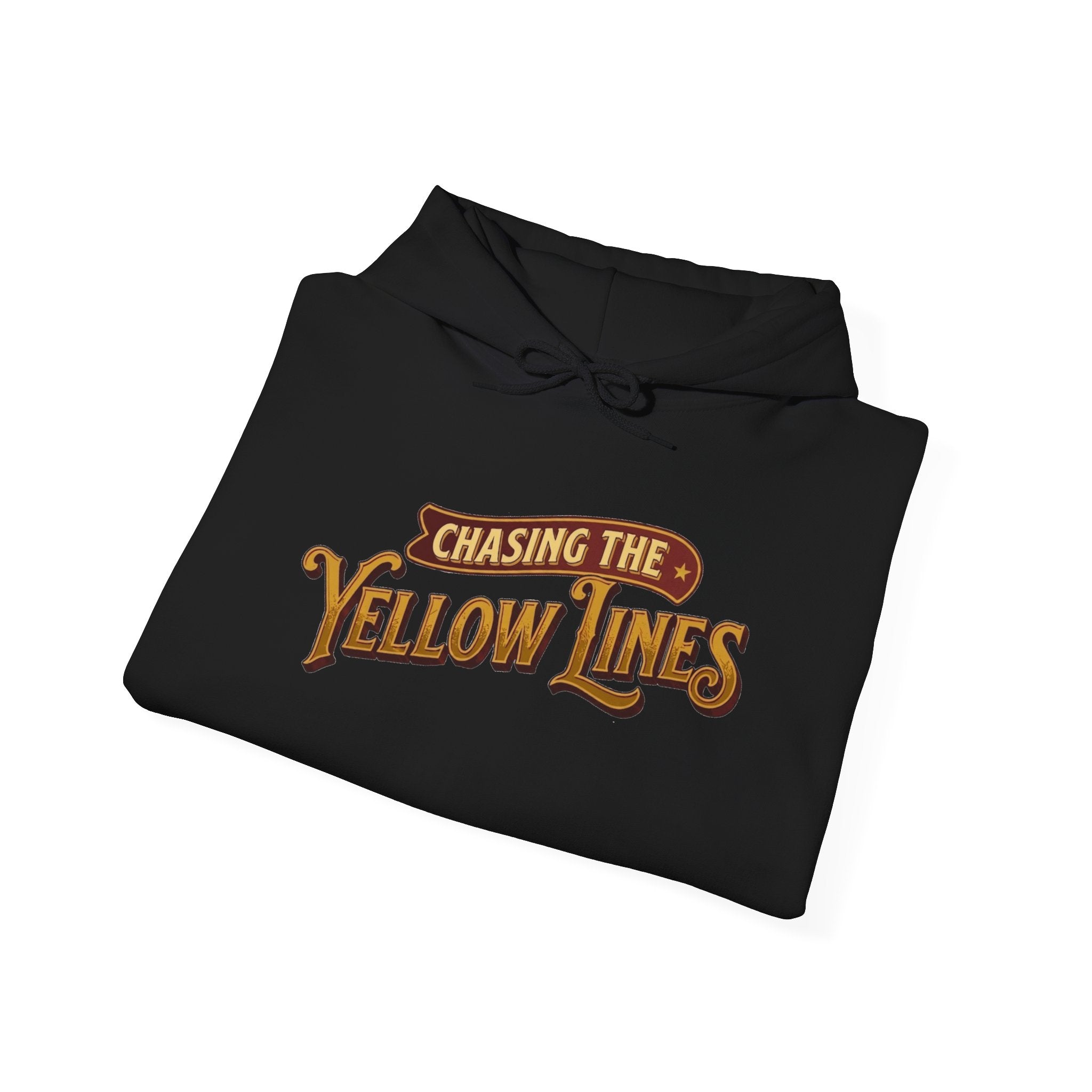 A folded black hoodie with a drawstring hood, featuring a vintage-style graphic on the front that reads 'Chasing the Yellow Lines' in gold and brown lettering, set against a plain white background.