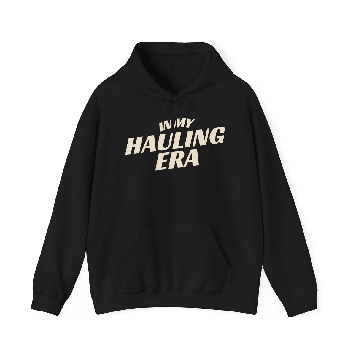 A black pullover hoodie with the phrase 'IN MY HAULING ERA' printed in a bold, cream-colored font across the chest, displayed on a clean white background.