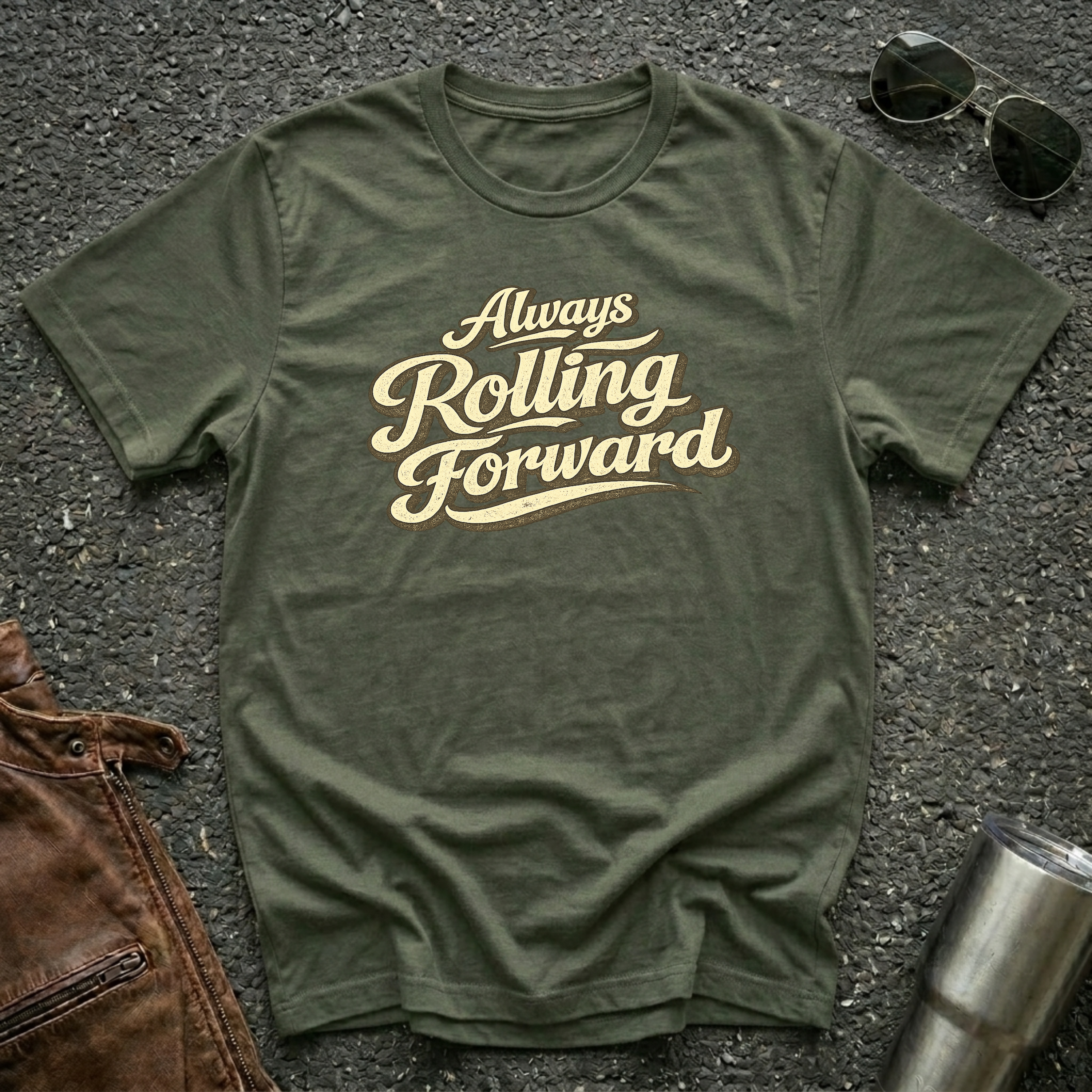 Military green 'Always Rolling Forward' road life T-shirt featuring vintage cream typography on a soft unisex tee.