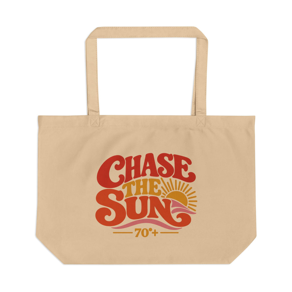 A beige canvas tote bag with a retro-style graphic that reads 'Chase the Sun 70+' in red, orange, and yellow, shown against a plain white background.