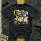Crosswinds Build Character T-shirt by The Riverstone Life on a black Gildan Softstyle 64000 featuring a vintage highway and RV Transport design inspired by life on the open road.