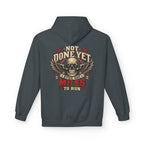 Dark heather hoodie with a skull and wings with the words 'NOT DONE YET STILL GOT MILES TO RUN'
