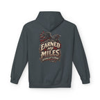 A dark heather hoodie shown from the back, featuring a graphic print of a raven and the text 'EARNED MY MILES' with 'NOTHING LEFT TO PROVE' underneath.