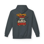 A dark heather hoodie shown from the back, featuring a colorful graphic text print that reads 'Wrong turns make better stories' in orange, red, cream, and black lettering.