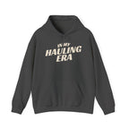 dark heather hoodie 'In My Hauling Era' on a white background