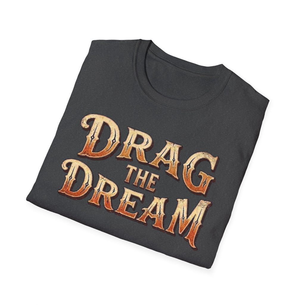 A folded dark heather t-shirt with a distressed orange and gold graphic text reading 'DRAG THE DREAM' on a clean white background.