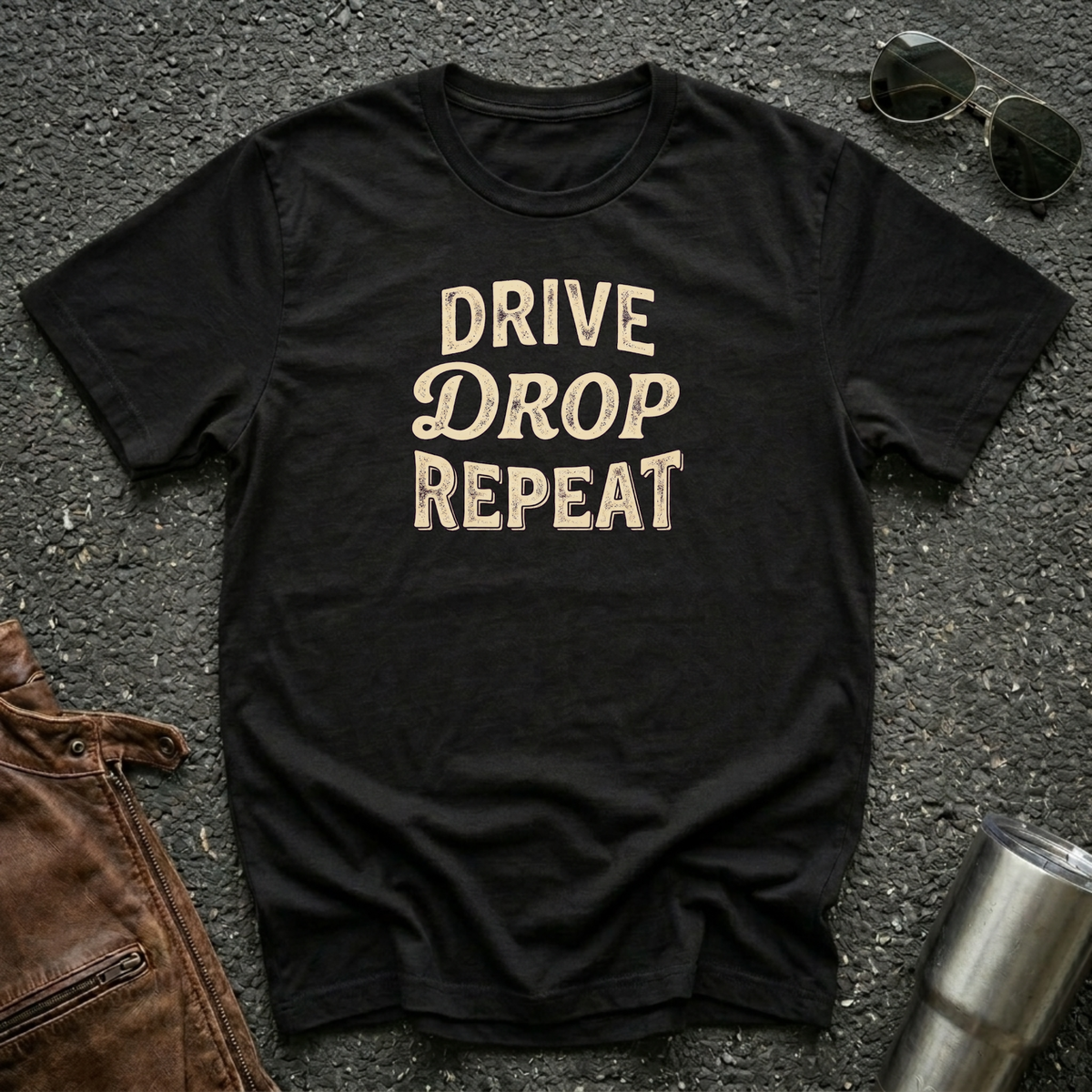 Drive Drop Repeat typography T-shirt on black Gildan 64000 unisex tee flat lay