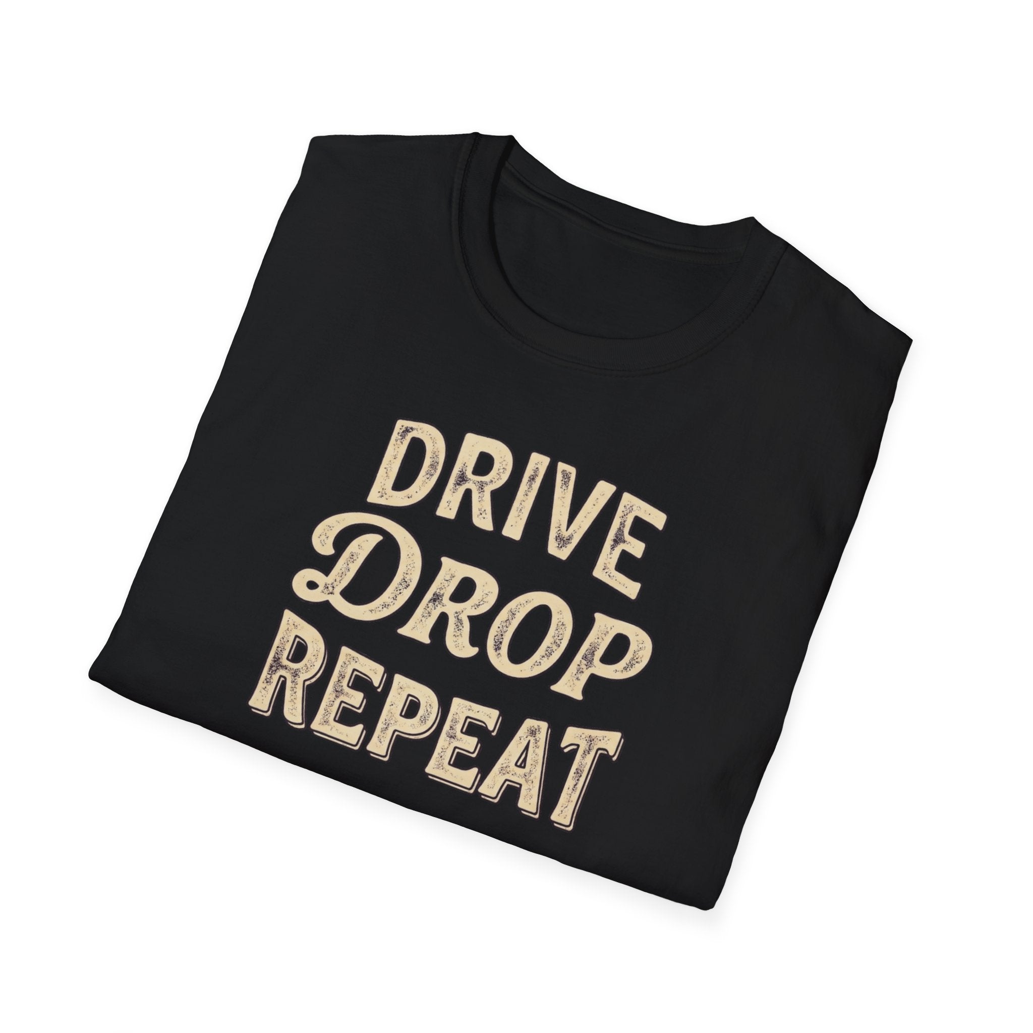 Folded black t-shirt typography vintage style with words Drive Drop Repeat on the front.