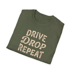 Folded military green t-shirt typography vintage style with words Drive Drop Repeat on the front.