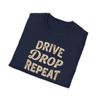 Folded navy t-shirt typography vintage style with words Drive Drop Repeat on the front.