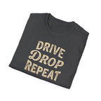 Folded gray t-shirt typography vintage style with words Drive Drop Repeat on the front.