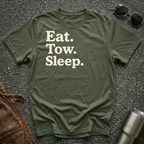 A military green crewneck t-shirt with the text 'Eat. Tow. Sleep.'