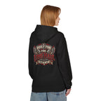 A woman shown from the back wearing a black hoodie with a large graphic print on the back that reads 'Built for the Long Haul' and 'No Mile to Last' in red, beige, and white. She is also wearing blue jeans against a plain white background.