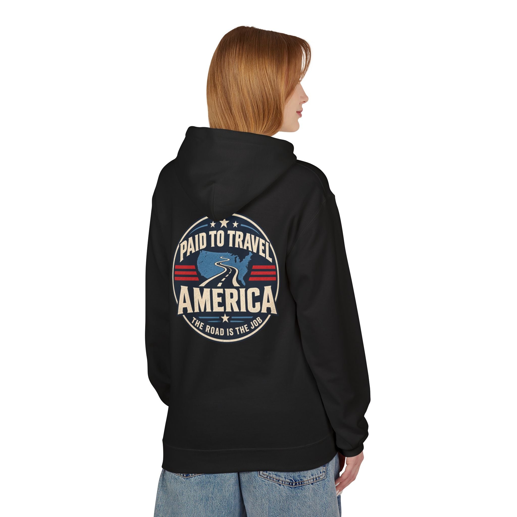A woman shown from the back wearing a black hoodie with a large circular graphic on the back that reads 'Paid to Travel America' and 'The Road is the Job' in red, white, and blue.