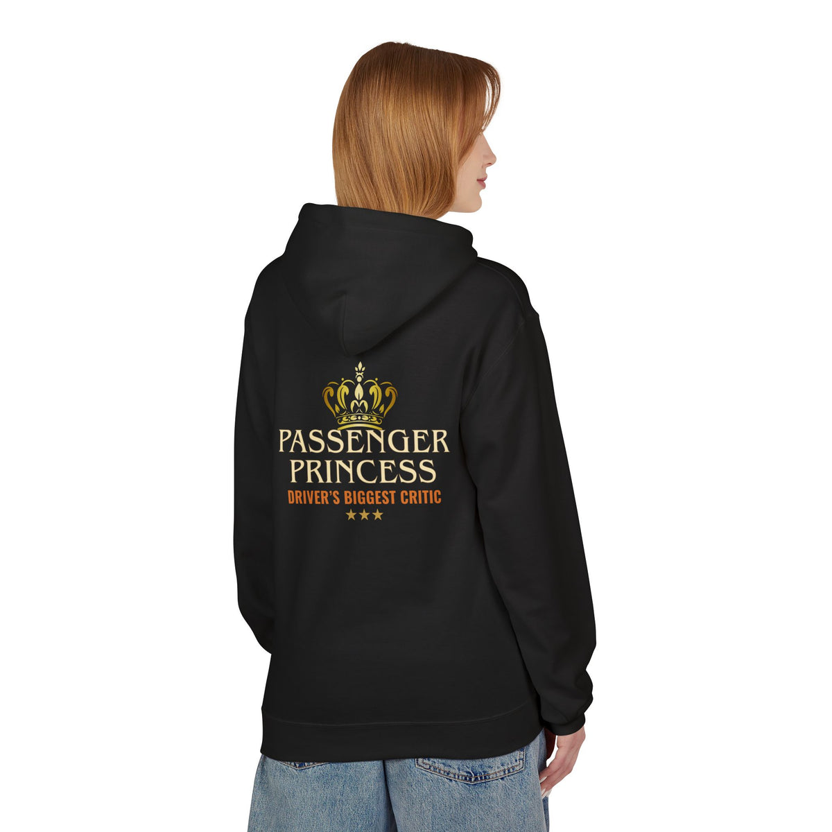 A woman shown from the back wearing a black hoodie with a gold and orange graphic on the back that reads 'PASSENGER PRINCESS' and 'DRIVER'S BIGGEST CRITIC'.