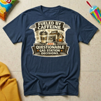 Fueled by Caffeine and Questionable Gas Station Decisions T-shirt by The Riverstone Life on a navy Gildan Softstyle 64000 featuring a coffee cup, gas station, and humorous road trip design.