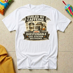 Fueled by Caffeine and Questionable Gas Station Decisions T-shirt by The Riverstone Life on a white Gildan Softstyle 64000 featuring a coffee cup, gas station, and humorous road trip design.