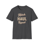 Dark heather t-shirt with 'Hitch Haul Repeat' typography vintage style on a white background.