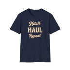Navy t-shirt with 'Hitch Haul Repeat' typography vintage style on a white background.