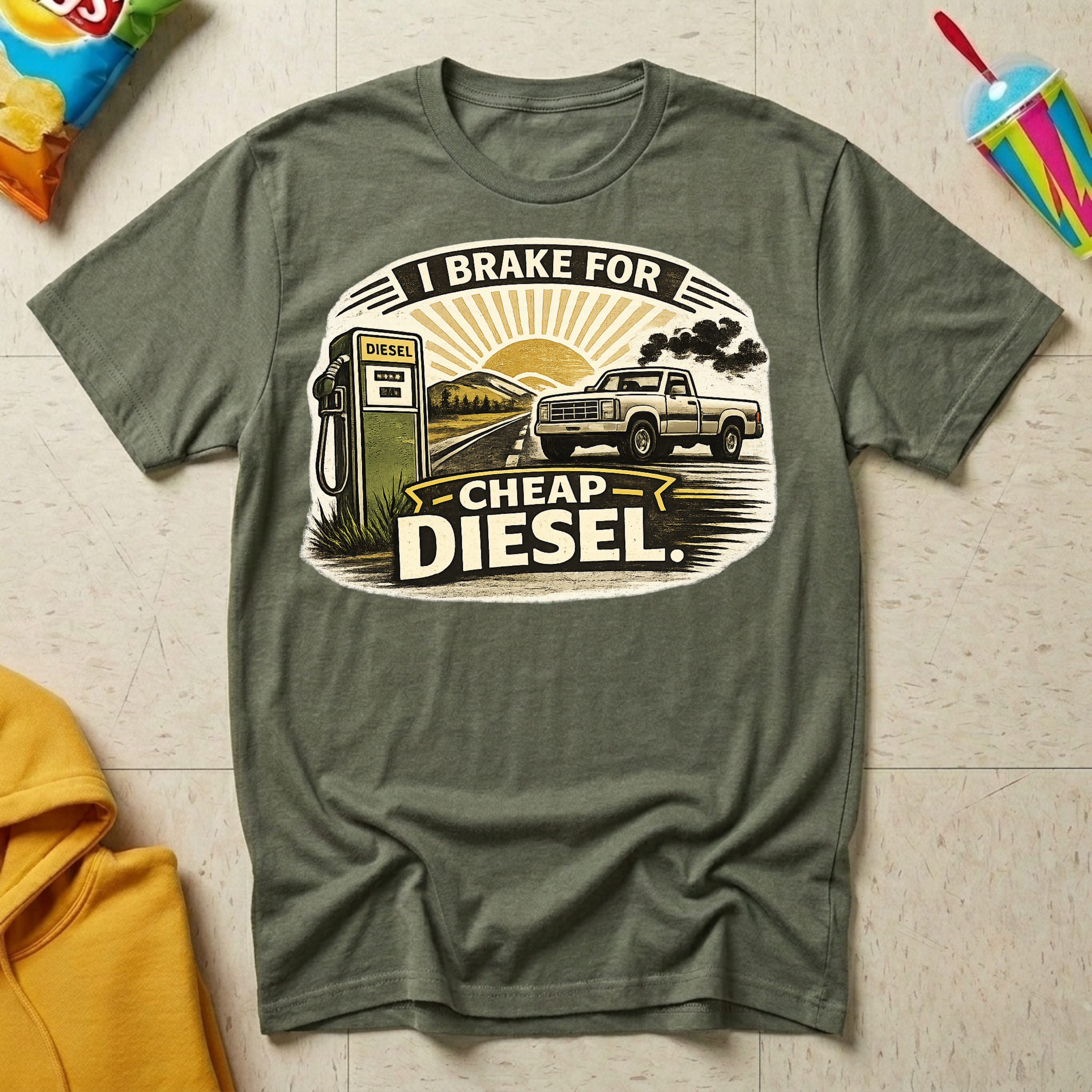 I Brake For Cheap Diesel T-shirt by The Riverstone Life on a military green Gildan Softstyle 64000 featuring a vintage diesel pump, pickup truck, and humorous road trip design.