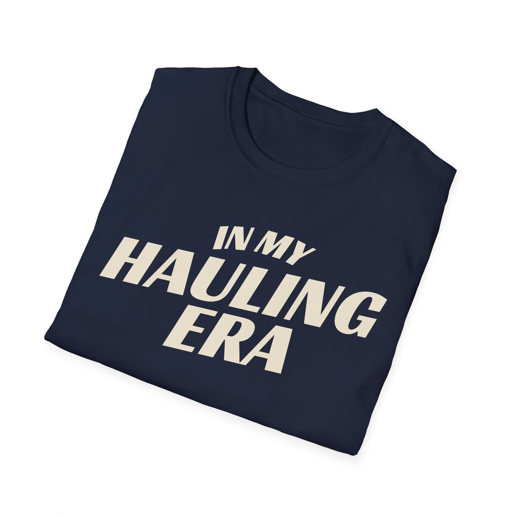 Folded navy 'In My Hauling Era' road life t-shirt featuring bold cream typography on a soft unisex tee.