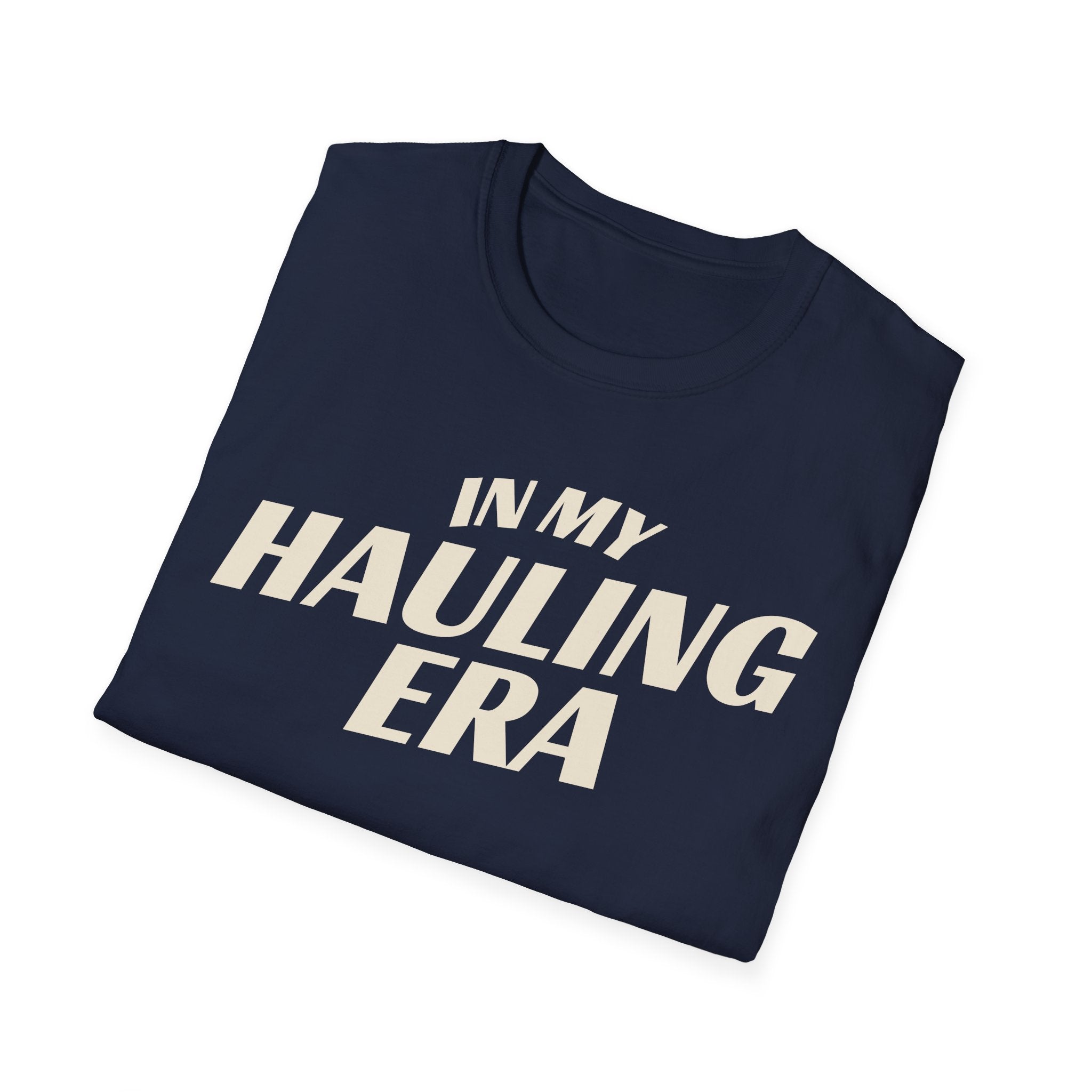 Folded navy 'In My Hauling Era' road life t-shirt featuring bold cream typography on a soft unisex tee.