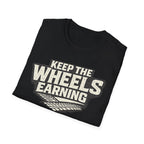 black 'keep the wheels earning' folded t-shirt with tracks on it with a white background.