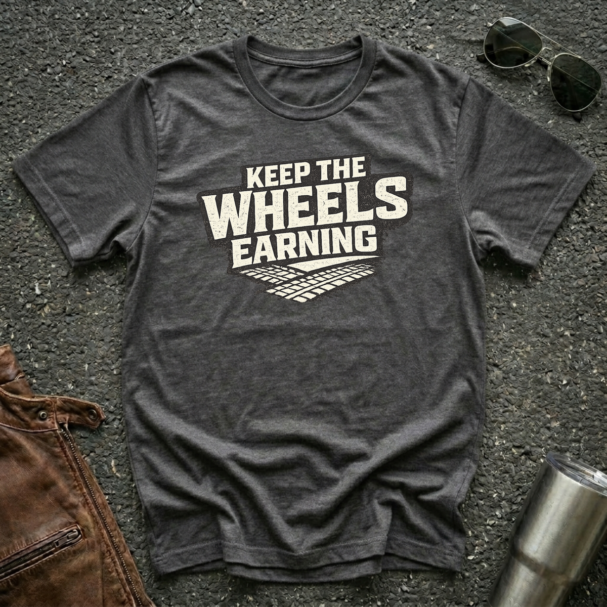 Dark heather t-shirt 'Keep The Wheels Earning' with tire tracks flat mockup