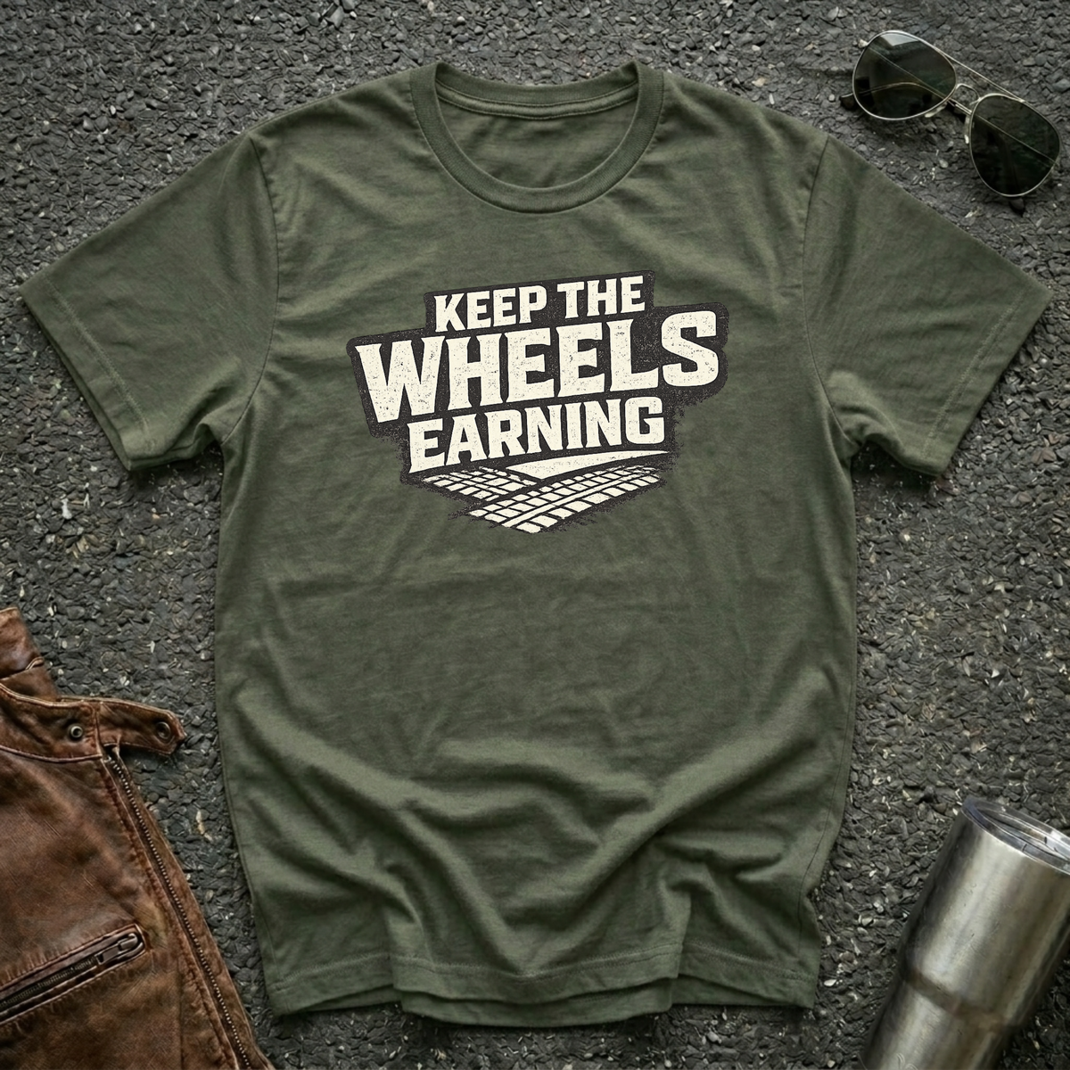 military green t-shirt 'Keep The Wheels Earning' with tire tracks flat mockup