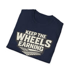 navy 'keep the wheels earning' t-shirt folded with tracks on it with a white background