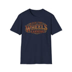 Navy 'Keep The Wheels Earning' vintage RV Transport T-shirt featuring vintage gold and rust typography on a soft unisex tee on a white background.