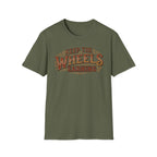 Military green 'Keep The Wheels Earning' vintage RV Transport T-shirt featuring vintage gold and rust typography on a soft unisex tee with a white background.