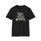 A black short-sleeve t-shirt with a distressed cream graphic reading 'LIFE BEHIND THE WHEEL' white background