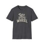 A dark heather short-sleeve t-shirt with a distressed cream graphic reading 'LIFE BEHIND THE WHEEL' white background