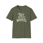 A military green short-sleeve t-shirt with a distressed cream graphic reading 'LIFE BEHIND THE WHEEL' white background