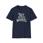 A navy blue short-sleeve t-shirt with a distressed cream graphic reading 'LIFE BEHIND THE WHEEL' white background