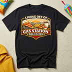 Living Off of Gas Station Delicacies T-shirt by The Riverstone Life on a black Gildan Softstyle 64000 featuring a vintage gas station food graphic with pizza, hot dogs, taquitos, and coffee.