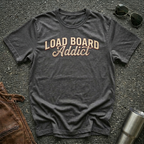 Load Board Addict dark heather typography design on Gildan 64000 unisex tee flat lay