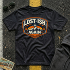 Lost-ish Again T-shirt in a black color featuring a vintage mountain and compass design for road trip enthusiast RV travelers, and outdoor adventurers.