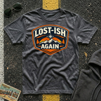 Lost-ish Again T-shirt in a dark heather color featuring a vintage mountain and compass design for road trip enthusiast RV travelers, and outdoor adventurers.