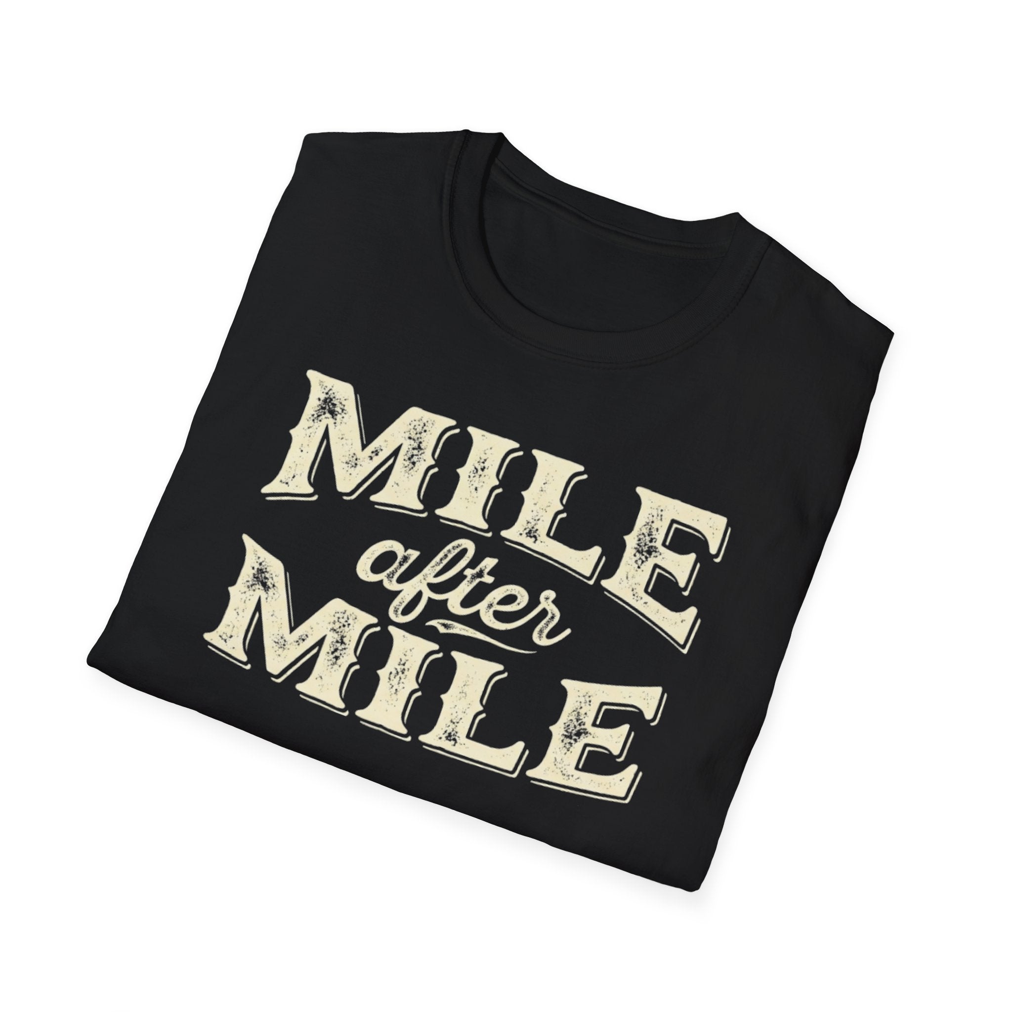 Black folded 'Mile After mile' t-shirt with a white background.